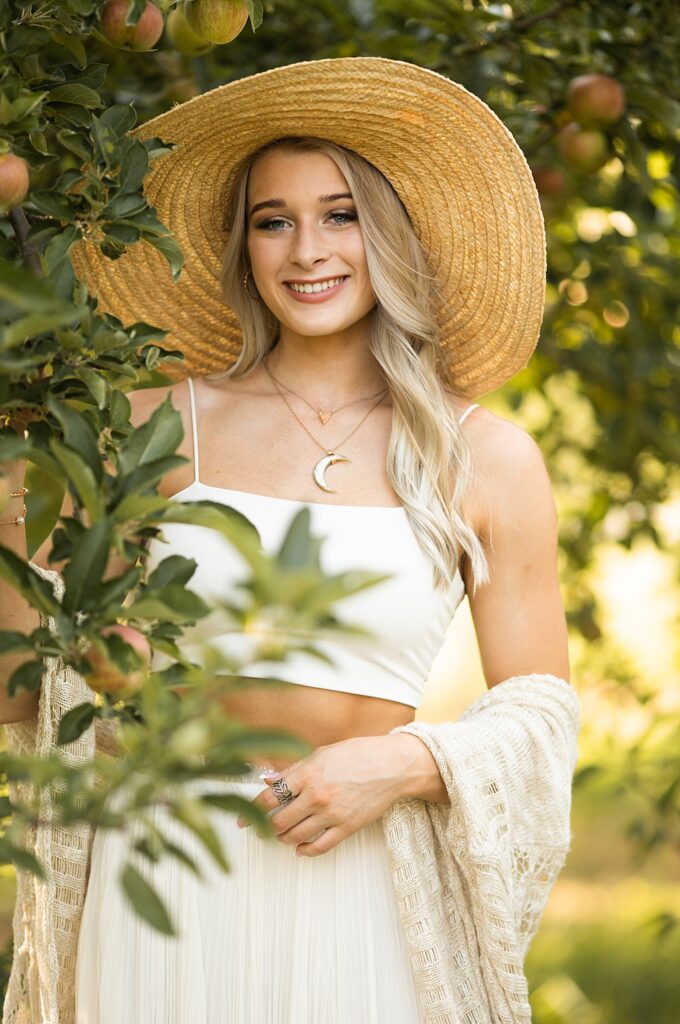 Senior portraits in an apple orchard in fort wayne, IN